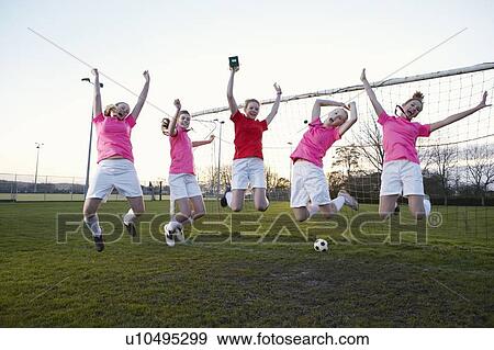 Football team cheering in field View Large Photo Image Stock Photo - Football team cheering in field. Fotosearch
