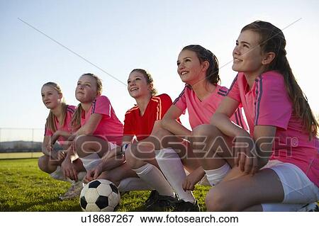 Football team smiling together in field View Large Photo Image Stock Photo - Football team smiling together in field. Fotosearch