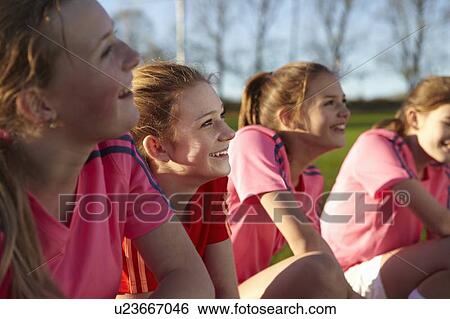 Football team smiling together in field View Large Photo Image Stock Photograph - Football team smiling together in field. Fotosearch