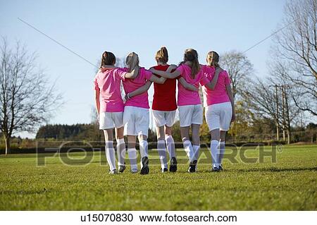 Football team walking together in field View Large Photo Image Stock Image - Football team walking together in field. Fotosearch