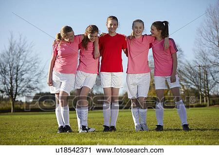 Football team walking together in field View Large Photo Image Stock Image - Football team walking together in field. Fotosearch