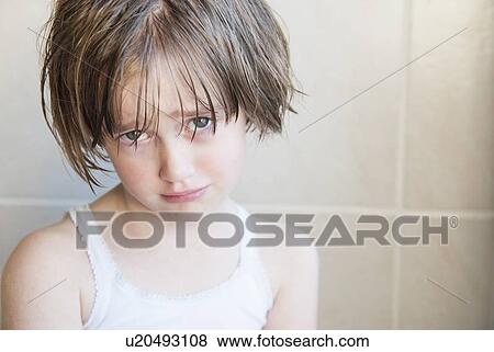 Stock Photo - Girl crying in bathroom. Fotosearch