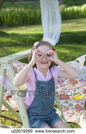 Girl making faces outdoors View Large Photo Image Stock Photo - Girl making faces outdoors. Fotosearch