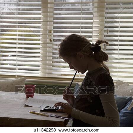 Girl using calculator to do homework View Large Photo Image Stock Photo - Girl using calculator to do homework. Fotosearch