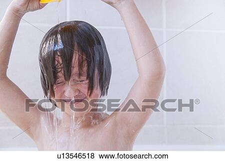Girl washing her hair in bath View Large Photo Image Stock Photo - Girl washing her hair in bath. Fotosearch