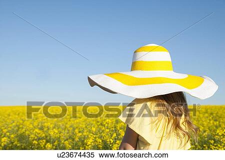 Girl wearing sun hat outdoors View Large Photo Image Stock Photography - Girl wearing sun hat outdoors. Fotosearch