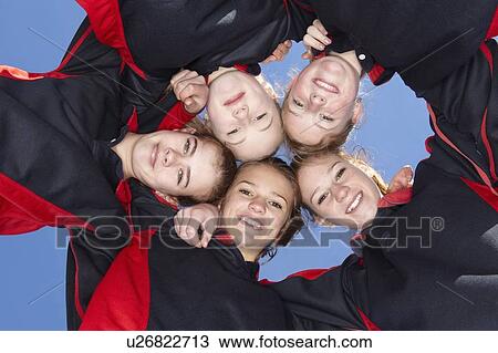 Stock Image - Girls smiling in circle. Fotosearch