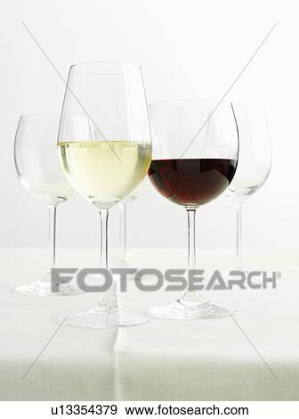 Glasses of red and white wines View Large Photo Image Stock Photo - Glasses of red and white wines. Fotosearch