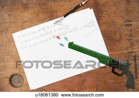 Gun shaped ruler and pen on paper View Large Photo Image Stock Image - Gun shaped ruler and pen on paper. Fotosearch
