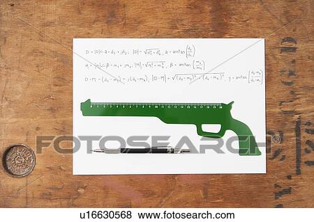 Gun shaped ruler and pen on paper View Large Photo Image Stock Photo - Gun shaped ruler and pen on paper. Fotosearch