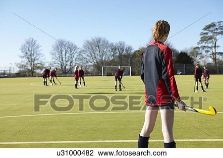 Lacrosse player standing in game View Large Photo Image Stock Image - Lacrosse player standing in game. Fotosearch