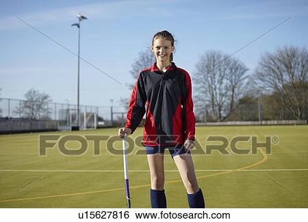 Lacrosse player standing on field View Large Photo Image Stock Photograph - Lacrosse player standing on field. Fotosearch
