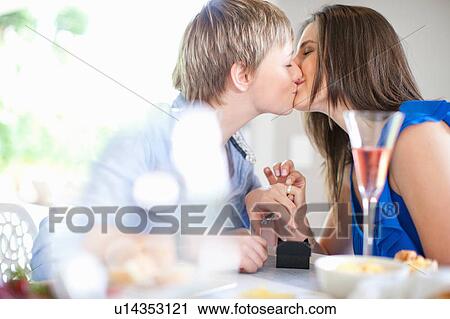 Stock Image - Lesbian couple getting engaged. Fotosearch