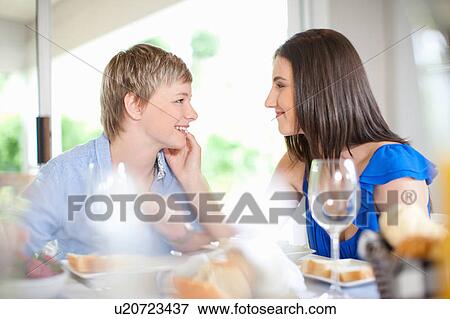 Lesbian couple having breakfast together View Large Photo Image Stock Photo - Lesbian couple having breakfast together. Fotosearch