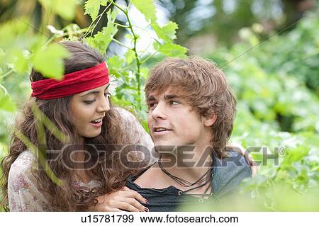 Man carrying girlfriend in tall plants View Large Photo Image Stock Photo - Man carrying girlfriend in tall plants. Fotosearch