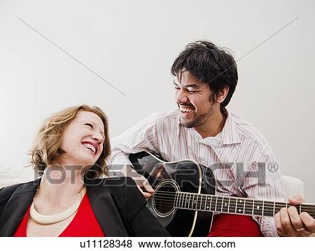 Man playing guitar for girlfriend View Large Photo Image Stock Photo - Man playing guitar for girlfriend. Fotosearch