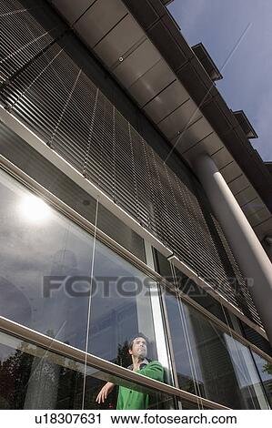 Man standing behind window View Large Photo Image Stock Image - Man standing behind window. Fotosearch