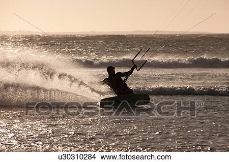 Man windsurfing in waves View Large Photo Image Picture - Man windsurfing in waves. Fotosearch