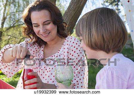 Mother and daughter having picnic View Large Photo Image Stock Photo - Mother and daughter having picnic. Fotosearch