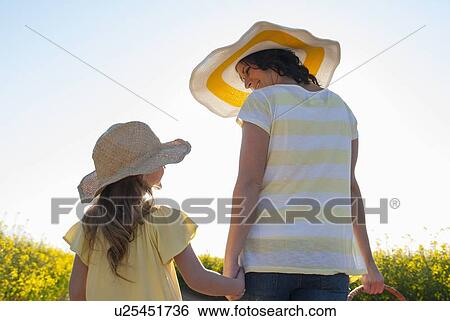 Mother and daughter holding hands View Large Photo Image Stock Photograph - Mother and daughter holding hands. Fotosearch