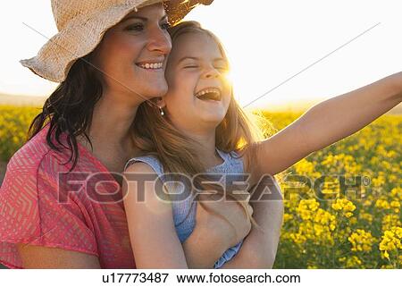 Mother and daughter hugging outdoors View Large Photo Image Stock Photo - Mother and daughter hugging outdoors. Fotosearch