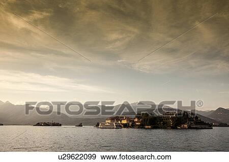 Mountains over rural village and lake View Large Photo Image Stock Photo - Mountains over rural village and lake. Fotosearch