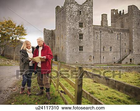 Older couple reading map by castle View Large Photo Image Stock Image - Older couple reading map by castle. Fotosearch