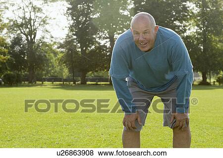 Older man resting in field View Large Photo Image Stock Photo - Older man resting in field. Fotosearch