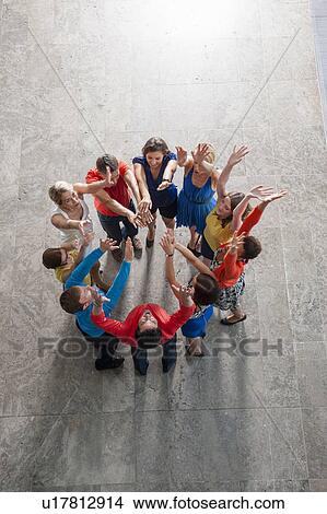 Overhead view of people cheering View Large Photo Image Picture - Overhead view of people cheering. Fotosearch