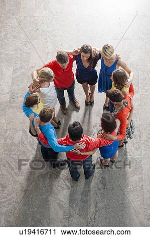 Overhead view of people in circle View Large Photo Image Stock Image - Overhead view of people in circle. Fotosearch