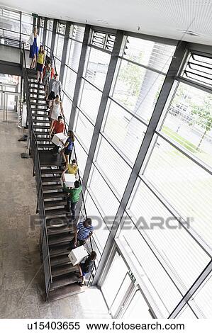 People passing boxes up stairs View Large Photo Image Stock Photography - People passing boxes up stairs. Fotosearch