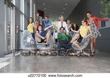 People playing on new office furniture View Large Photo Image Stock Image - People playing on new office furniture. Fotosearch