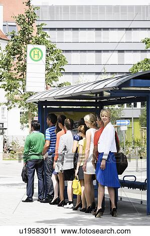 People waiting at bus stop View Large Photo Image Stock Image - People waiting at bus stop. Fotosearch