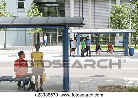 People waiting at bus stops View Large Photo Image Stock Image - People waiting at bus stops. Fotosearch