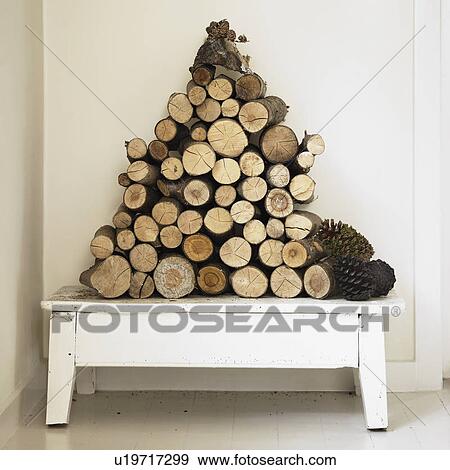Pile of firewood on bench View Large Photo Image Stock Photo - Pile of firewood on bench. Fotosearch