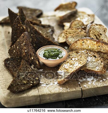 Stock Photograph - Plate of bread with dipping sauce. Fotosearch