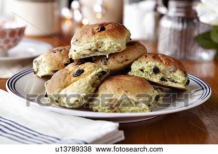 Stock Photo - Plate of fruit scones on table. Fotosearch