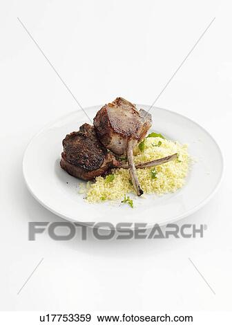 Plate of lamb cutlet with couscous View Large Photo Image Stock Photo - Plate of lamb cutlet with couscous. Fotosearch