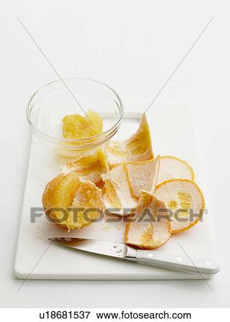 Stock Photo - Plate of peeled grapefruit. Fotosearch
