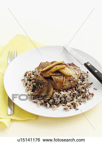 Plate of pork with wild rice View Large Photo Image Stock Photograph - Plate of pork with wild rice. Fotosearch