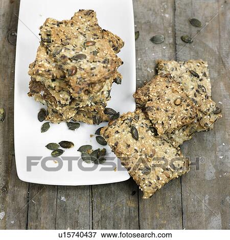 Stock Photo - Plate of whole grain crackers. Fotosearch