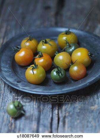 Plate of yellow cherry tomatoes View Large Photo Image Stock Photo - Plate of yellow cherry tomatoes. Fotosearch