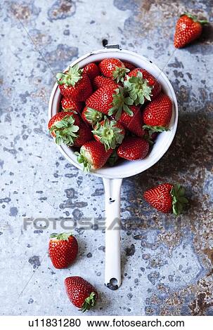 Pot of strawberries on table View Large Photo Image Stock Image - Pot of strawberries on table. Fotosearch