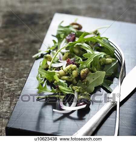 Stock Photo - Salad on wooden board. Fotosearch