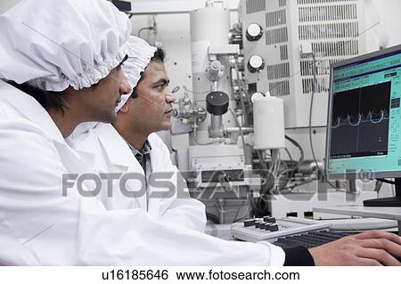 Stock Photograph - Scientists working in lab. Fotosearch
