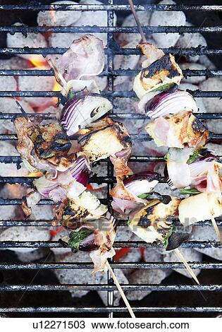 Skewers cooking on grill View Large Photo Image Stock Image - Skewers cooking on grill. Fotosearch
