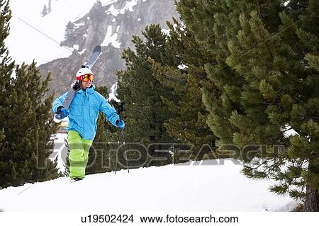 Skier climbing snowy slope View Large Photo Image Picture - Skier climbing snowy slope. Fotosearch