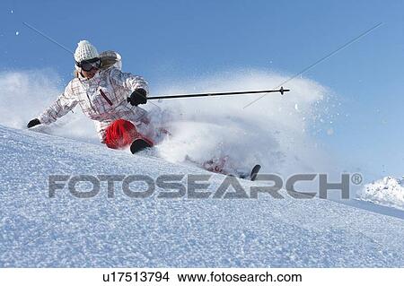 Picture - Skier on snowy slope. Fotosearch