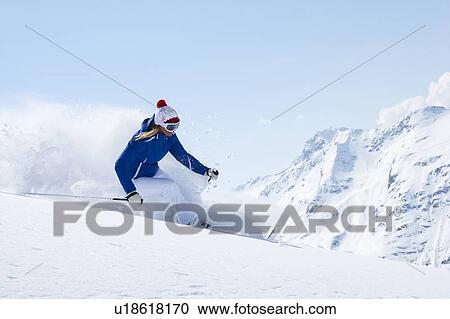 Stock Image - Skier on snowy slope. Fotosearch
