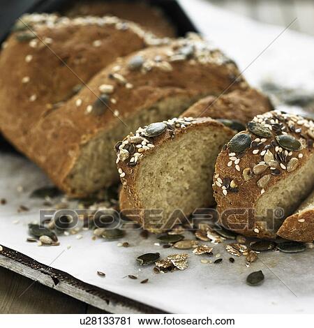 Sliced whole grain bread on board View Large Photo Image Stock Image - Sliced whole grain bread on board. Fotosearch